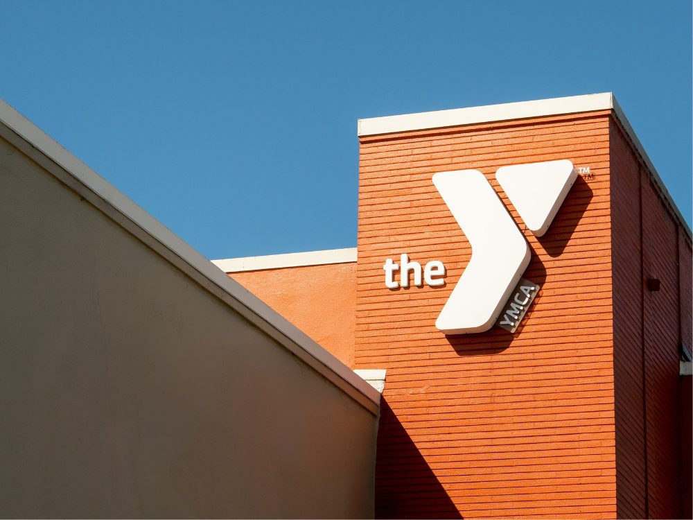 YMCA logo as a sign on the exterior of a building